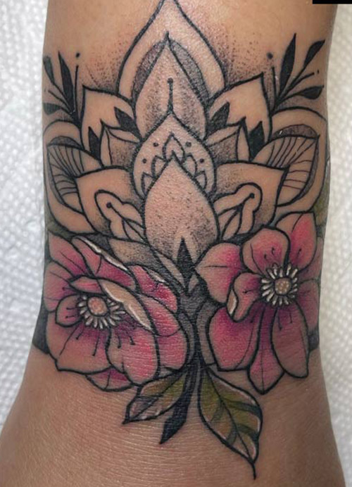 Mandala and flowers tattoo done by Rene