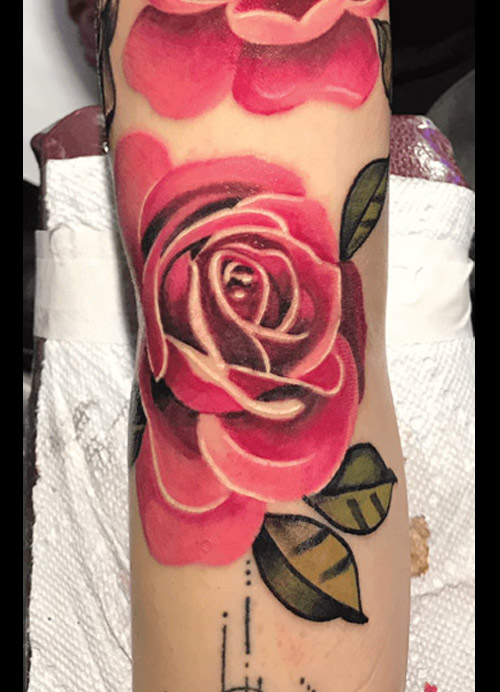 Awesone flowers tattoo done by Rene Queens NY